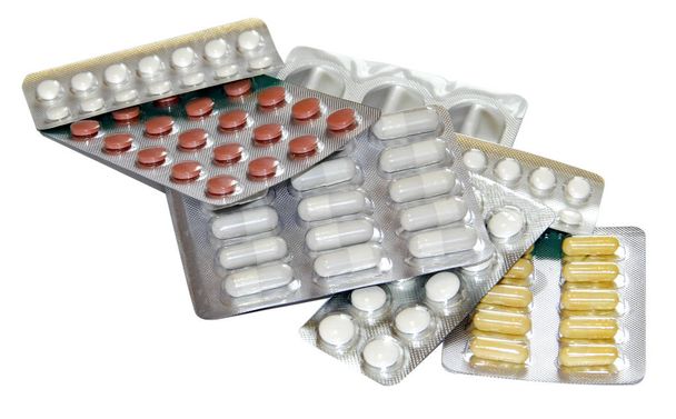 Σύνολο από πολύχρωμα χάπια σε λευκό Συσκευασίες κυψέλης  - Φωτογραφία, εικόνα