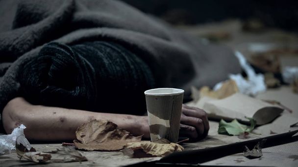Homeless vagabond sleeping on cold night city street, refugee seeking asylum - Foto, imagen