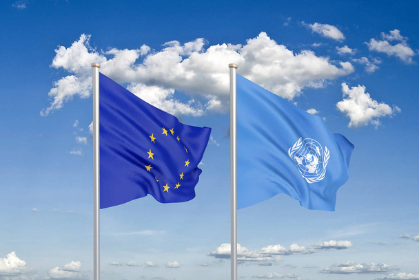 Euroopan unioni vastaan Yhdistyneet Kansakunnat. Paksu värillinen silkkinen lippuja Euroopan unionin ja Yhdistyneiden Kansakuntien. 3D-kuva taivaalla taustalla. - Kuvitus
 - Valokuva, kuva