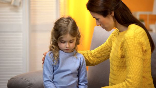 Mum supporting small daughter, giving advice about problems in school, care - Photo, Image