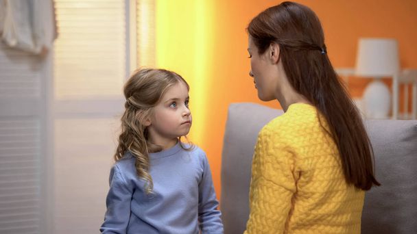 Little girl carefully listening to psychologist, kid crisis prevention childcare - Photo, Image