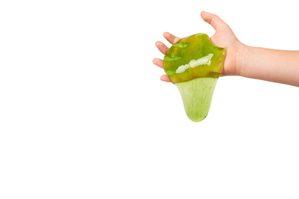 teenager playing green slime with hand, transparent toy - Photo, image