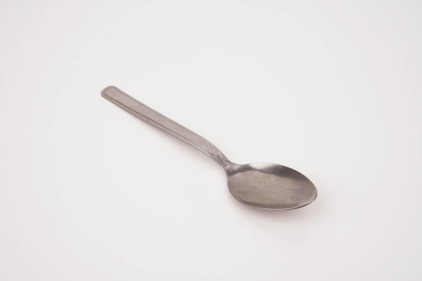 Steel silver spoon isolated on white background - Fotó, kép