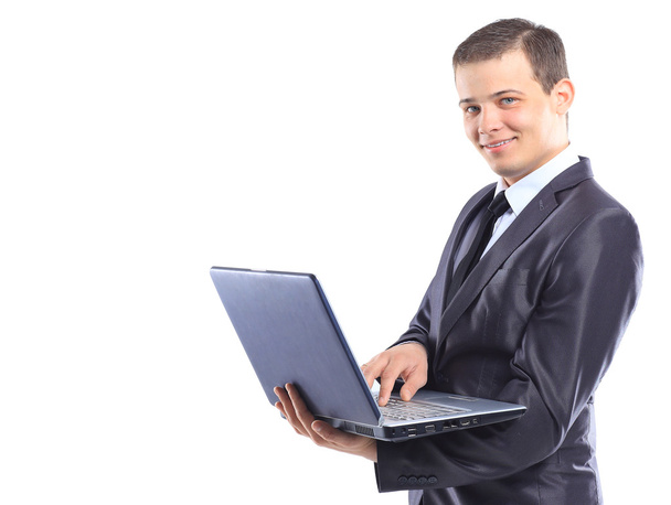 Businessman with a laptop. - Фото, изображение