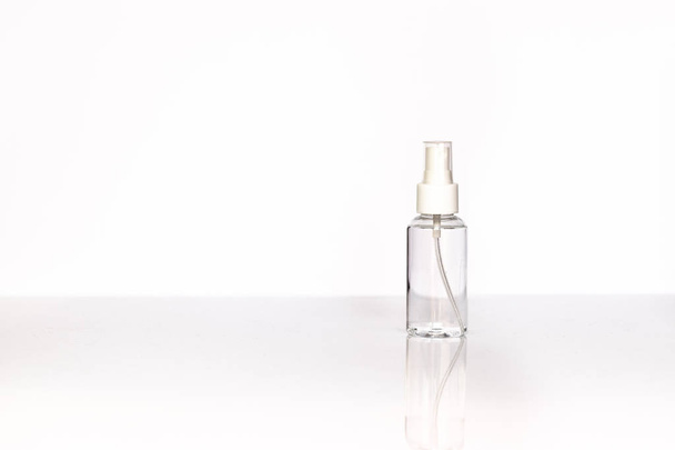 Beauty cosmetics glassbottle; branding mock up; front view on pastel white background. Package for essential oil. - Фото, зображення