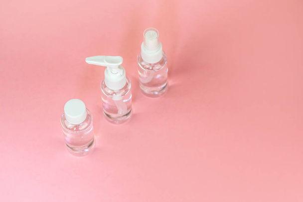 Beauty cosmetics glassbottle; branding mock up; front view on pastel pink background. Package for essential oil. - Zdjęcie, obraz