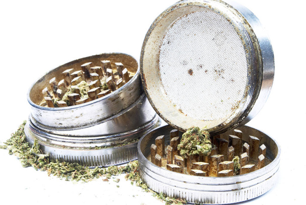 Close up view of marijuana and weed crushers on white background - Photo, Image