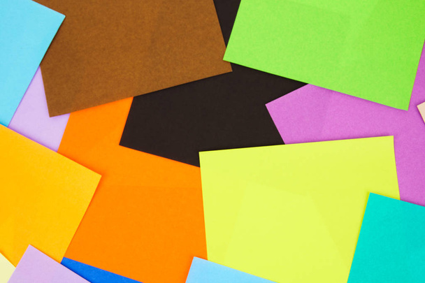 Colorful paper scatter on background. Top view, flat lay concept. - Photo, Image