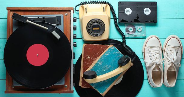 Obsolete objects on the Blue wooden background. Retro style, 80s, pop media - Foto, Imagem