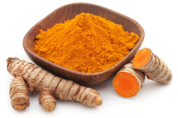 Raw turmeric with powder in a bowl - Photo, Image