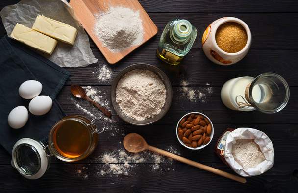 Ingredients for baking on a wooden background top view - 写真・画像