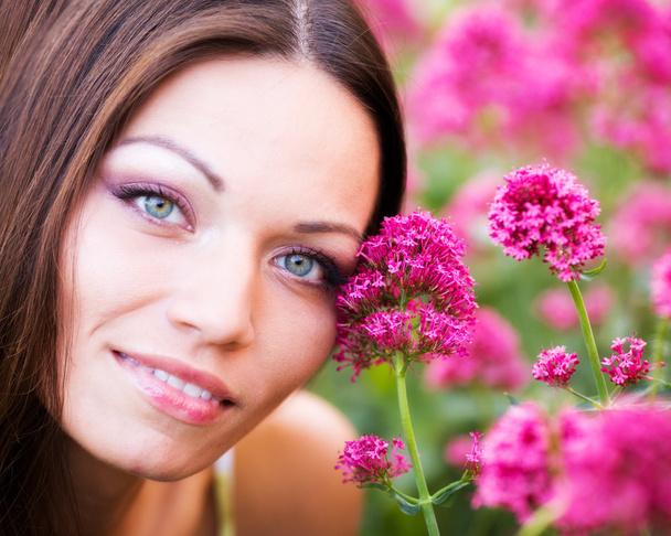 Woman in flower garden - Zdjęcie, obraz