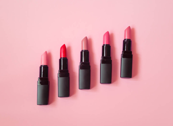 Set of beautiful lipsticks on pink background. - Foto, Imagem