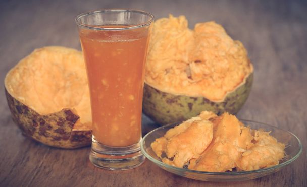 Medicinal Bael fruit with juice in a glass - Photo, Image