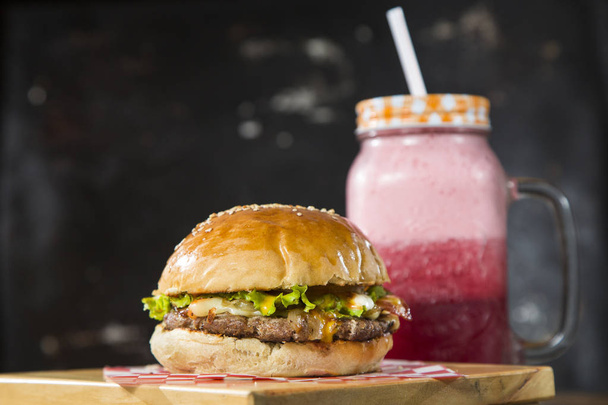 Colombian street hamburger - Blackberry Juice. Text space - Foto, afbeelding
