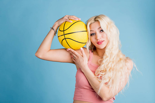 Young woman with a basket ball. - Fotó, kép