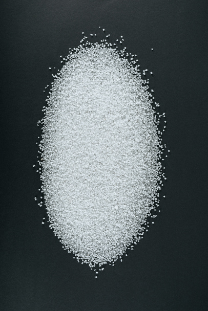top view of sweet white sugar crystals on black background - Photo, Image