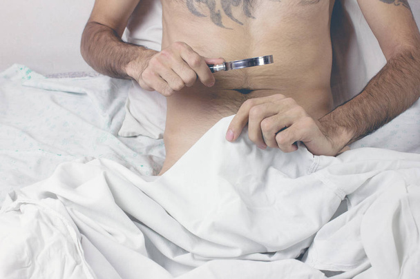 Man looking in his underwear  - Foto, afbeelding
