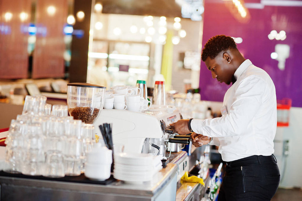 African american bartender barista at bar preparing coffee. - Фото, изображение