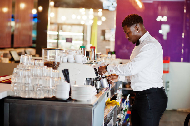 African american bartender barista at bar preparing coffee. - Fotó, kép