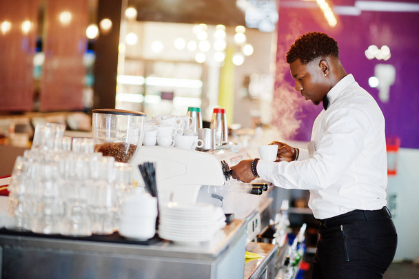 African american bartender barista at bar preparing coffee. - Foto, afbeelding