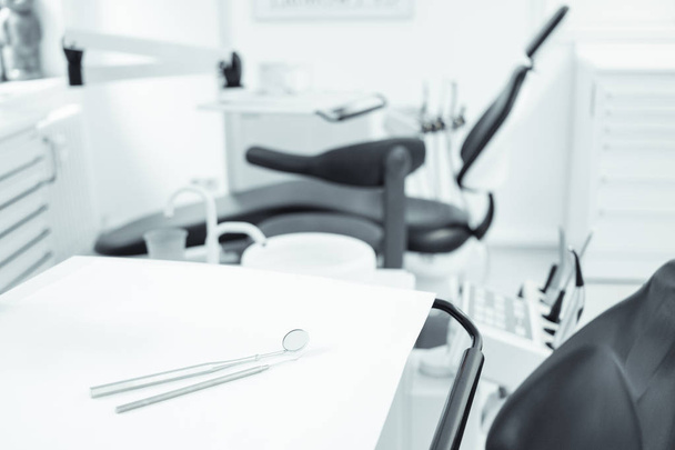 dentist concept, tools on  dentist chair in dental clinic interi - Foto, afbeelding