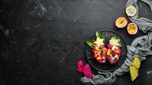 Dragon fruit. Tropical Fruit Salad. Top view. Free space for text. - Photo, image