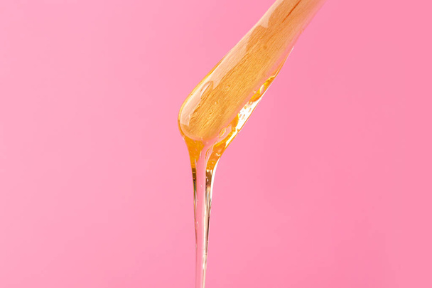 Stick with sugaring paste on color background - Fotó, kép