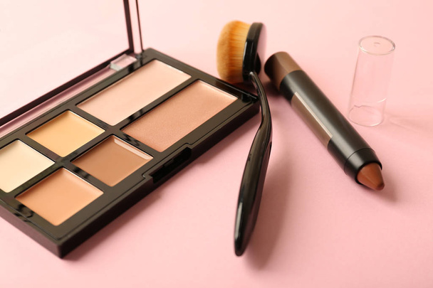 Set of cosmetics for contouring makeup on color background - Photo, Image