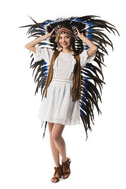 full length view of smiling woman in indian headdress isolated on white - Φωτογραφία, εικόνα