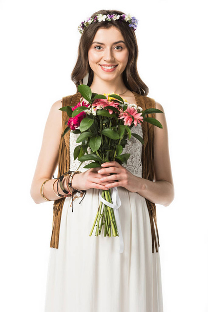 front view of pregnant hippie woman in wreath holding flowers isolated on white - Φωτογραφία, εικόνα