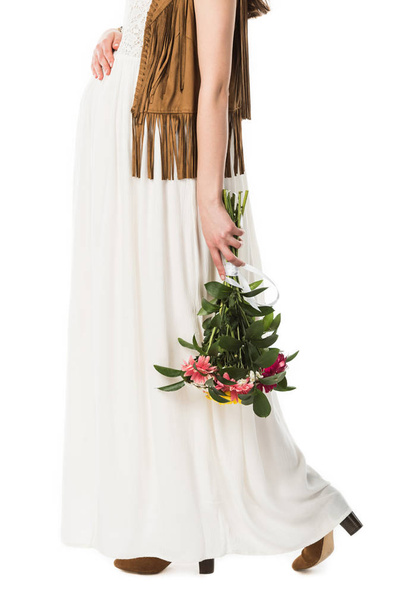 cropped view of pregnant boho woman holding flowers isolated on white - Fotó, kép