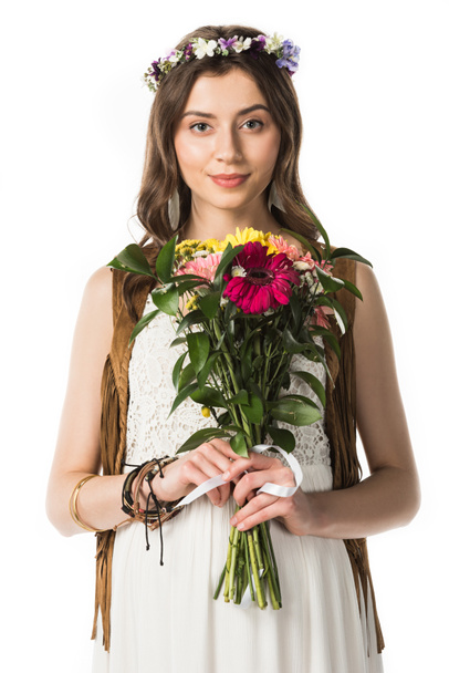 front view of pregnant hippie woman in wreath holding flowers isolated on white - Φωτογραφία, εικόνα