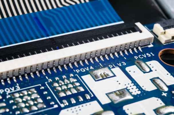 Macro shot of Circuit board with resistors microchips and electronic components. Computer hardware technology. Integrated communication processor. Information engineering. Semiconductor. PCB. Closeup - Φωτογραφία, εικόνα