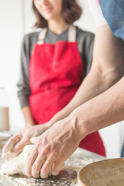 man and woman hands dough in the kitchen - Φωτογραφία, εικόνα
