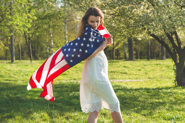 Happy women with American flag USA celebrate 4th of July - Foto, imagen