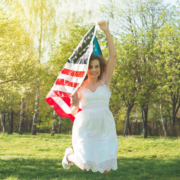 Happy women with American flag USA celebrate 4th of July - Photo, Image