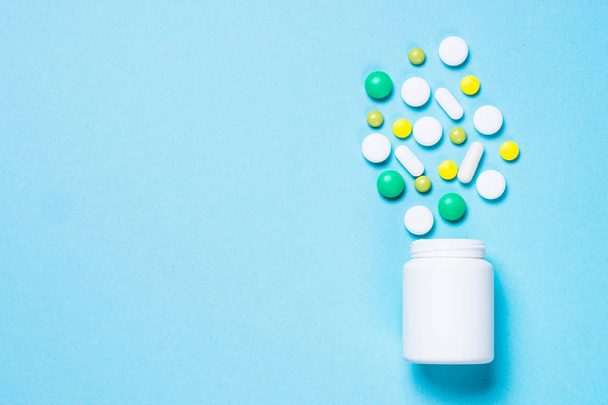 Pills, tablets and vitamin on blue - Фото, зображення