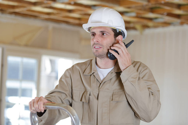 worker using walkie talkie - Fotó, kép