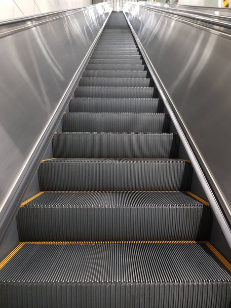 Modern escalator and staircase in subway station - Foto, afbeelding