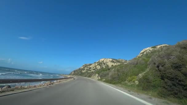 car rides along the road along the sea and mountains, view from the car - Footage, Video