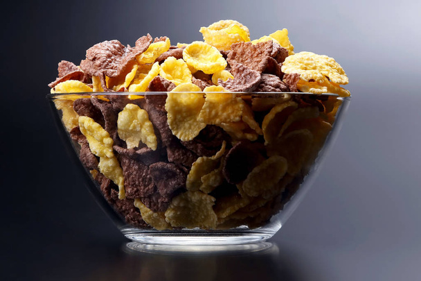 colored corn flakes in a bowl. snack food for Breakfas - Photo, Image