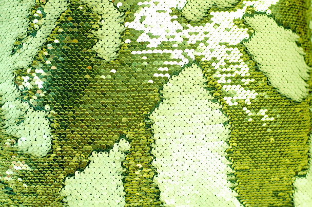 Текстура ткани с мерцающими зелеными блестками
. - Фото, изображение
