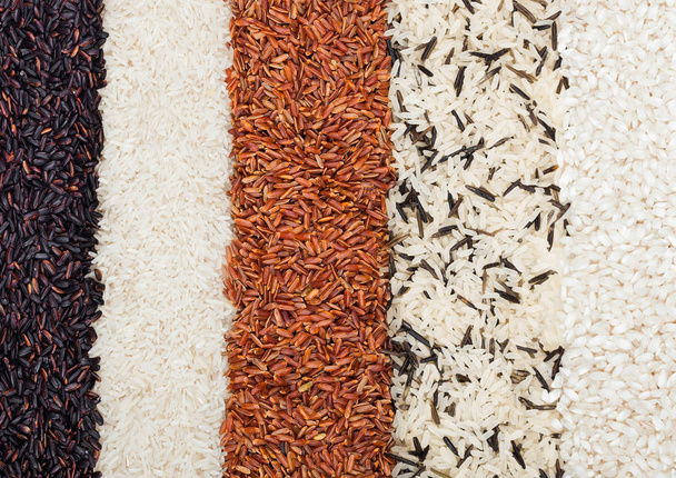 Fresh raw organic black venus and red rice,long grain basmati and wild rice.Healthy food.Macro texture - Valokuva, kuva