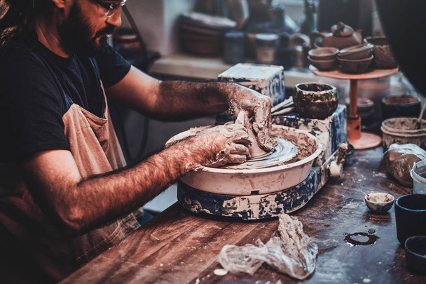 Talented artist at his own pottery studio is workig for new project. - Photo, Image