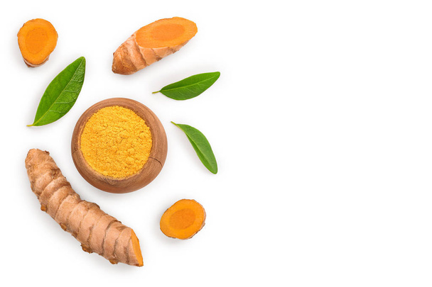 Turmeric powder and turmeric root isolated on white background with copy space for your text. Top view. Flat lay - Photo, Image