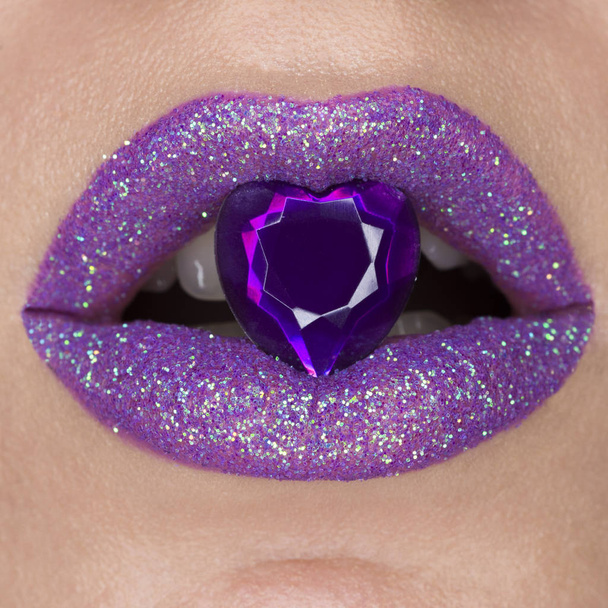 Close up beautiful purple violet lips with jewel - Photo, Image