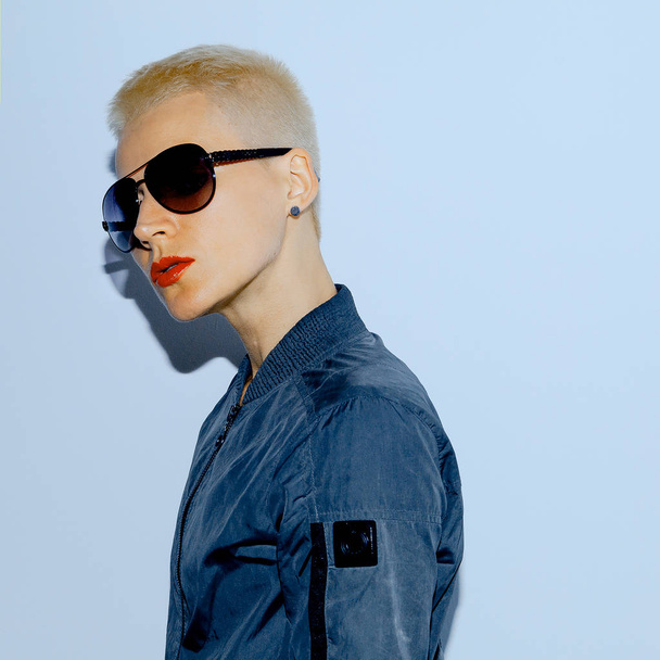 Blonde Model with trend  short hair  in military style and fashi - 写真・画像