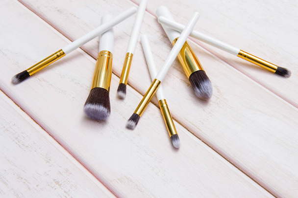Set of makeup brushes on pink wooden background - Photo, Image