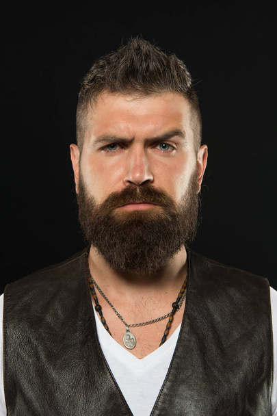 Bearded confident hipster. Beard fashion and barber concept. Man handsome hipster stylish beard and mustache. Beauty and masculinity. Barber tips maintain beard. Styling and trimming beard care - 写真・画像
